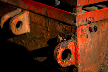 Rusty and dirty metal surface with old red paint.