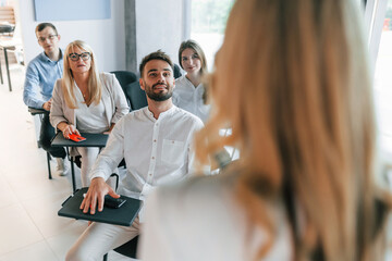 Learning process. Group of professional business people is in the office