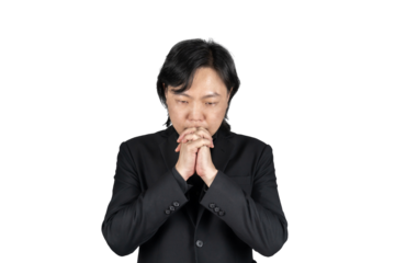Isolated Asian business man in black suit hand together and prays for something on white background. Clipping Path.