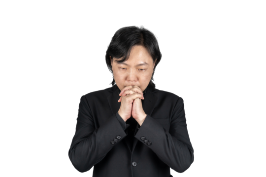 Isolated Asian business man in black suit hand together and prays for something on white background. Clipping Path. - Powered by Adobe