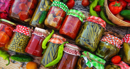 Jars with preserved vegetables for the winter. Selective focus.