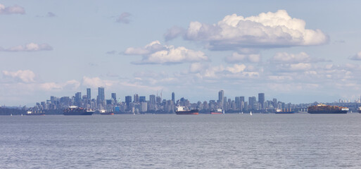 Downtown City Skyline with Industrial Cargo Ships. Sunny Cloudy Day. Vancouver, British Columbia, Canada.