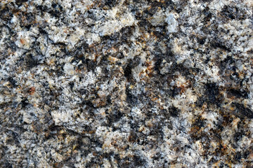 Beautiful background of gray-red granite. Granite stone close-up.