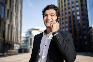Businessman with glasses man talking phone to work in office in business suit