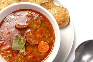 Homemade lentil stew with vegetables and chorizo