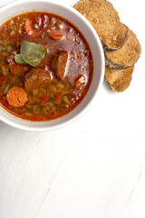 Homemade lentil stew with vegetables and chorizo