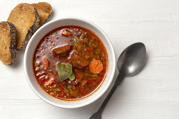 Homemade lentil stew with vegetables and chorizo