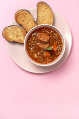 Homemade lentil stew with vegetables and chorizo