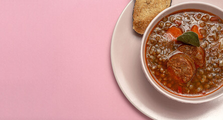 Homemade lentil stew with vegetables and chorizo
