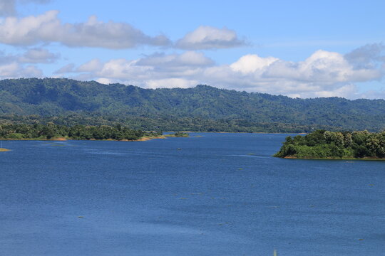 Beautiful mountain lake view on a sunny or clear day. Kaptai Lake in mountains with forest lake.Landscape, Natural scenery, panoramic view etc.