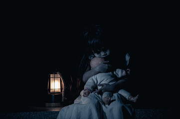 Naklejka na ściany i meble sad child ghost at night,Halloween Festival concept,Friday 13th,Horror movie scene,A girl with doll