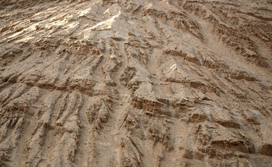 sandy surface of a sand quarry wall. material for concrete