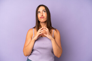 hispanic pretty woman scheming and conspiring, thinking devious tricks and cheats, cunning and...