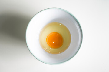 white and egg filled on a ceramic bowl