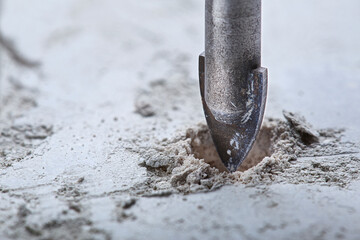 Ceramic drill bit make holes in concrete wall with industrial drill. Building work industry.