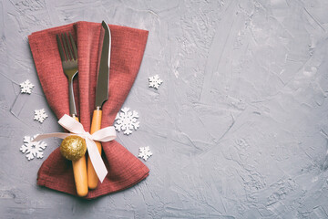 Christmas table place setting with knife, napkin and fork. Holidays new year background with copy...