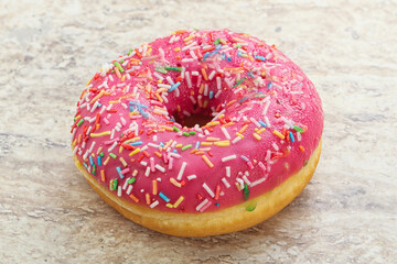 Sweet glazed struwberry donut with icing