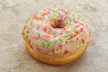 Sweet glazed vanilla donut with icing