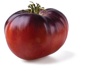 Close up view of black tomato isolated on white background.