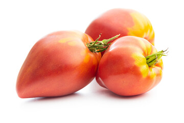 Bull heart tomatoes isolated on white background.
