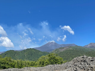 volcano landscape against a blue sky