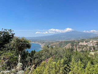 Fototapeta na wymiar overview of Taormina shoreline and landscape with Etna in the background