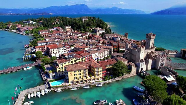 Aerial drone 3 pack bundle of Sirmione peninsula and Scaliger Castle fortress with Jamaica beach at Lake Garda Lombardy Northern Italy 4K
