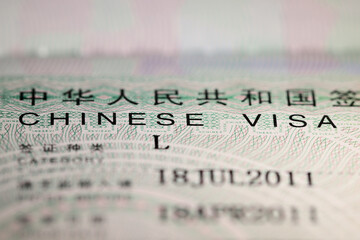 Chinese visa sticker in passport - obrazy, fototapety, plakaty