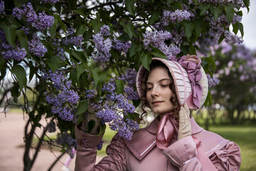 Young woman in historical dress. Fashionable clothes of the 19th century. Historical women's...
