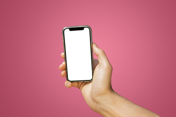 Fototapeta na wymiar Mobile phone with empty white screen in hand on bright pink - red background
