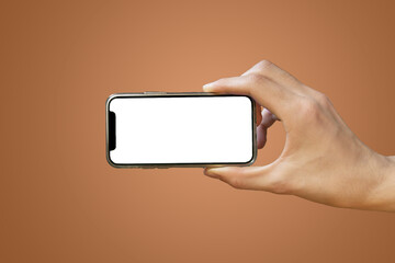 Mobile phone with empty white screen in hand on bright orange background