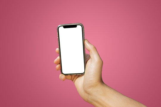 Mobile phone with empty white screen in hand on bright pink - red background