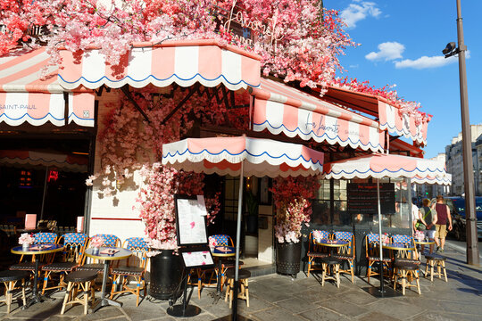 The traditional French cafe Favorite decorated with flowers . It located at famous Rivoli street in Paris, France.