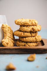 nutmeg nut butter chip cookies on wooden background glass milk
