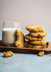 nutmeg nut butter chip cookies on wooden background glass milk