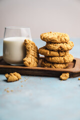 nutmeg nut butter chip cookies on wooden background glass milk
