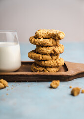 nutmeg nut butter chip cookies on wooden background glass milk