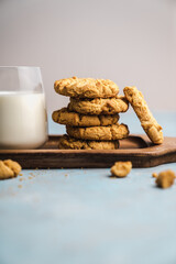 nutmeg nut butter chip cookies on wooden background glass milk