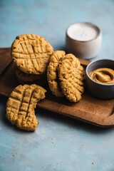 nutmeg nut butter chip cookies on wooden background glass milk