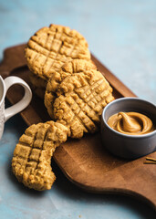 nutmeg nut butter chip cookies on wooden background glass milk