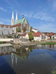 2-04-29 view of the old town with gothic medieval St. Peter and Paul Church or Peterskirche with two white towers from the side of the river neisse. Goerlitz, Germany