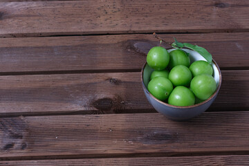 green pulms on wooden table
