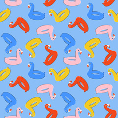 Seamless summer pattern with colorful inflatable rubber flamingos in bright blue, rred, pink, yellow colors in flat style. For print, package, wrapper, background.