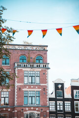 Pride flags over a building in Amsterdam