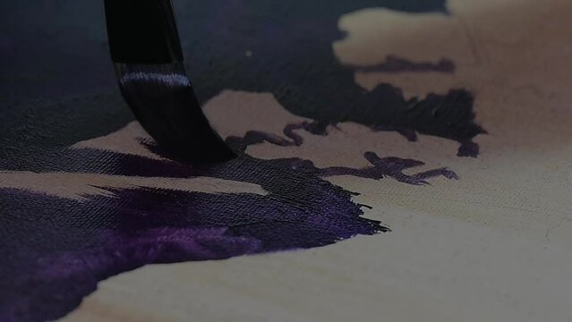 Water colour paintbrush in action. Close up and slow motion. A watercolor paintbrush gracefully sweeps across paper, captured in close-up and slow motion, blending vibrant hues artfully.