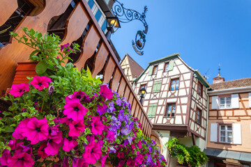 Riquewihr alsatian architecture at springtime with flowers, Eastern France