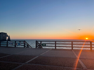 Beautiful sunset or sunrise over the sea. Colorful cloud band above the horizon.