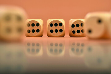closeup shot of wooden dices with numbers on brown background 