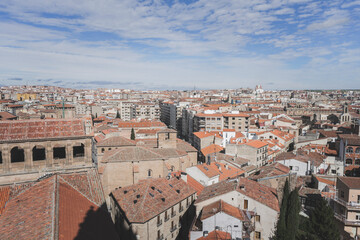 Panoramic view of the city of Salamanca desde lo alto de la iglesia on a summer day with the sky almost clear and bluish.
