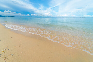 Sea wave white sand beach blue sky fluffy cloud summer vacation